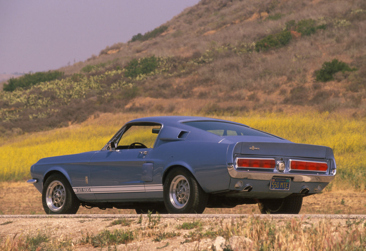 This archival image documents the 1967 Ford Mustang Shelby GT 500 rear view on scenic road and is preserved in the Ford Heritage Vault as part of Ford Motor Company's historic photographic archive. Free for personal, non-commercial use. Ford Herit...