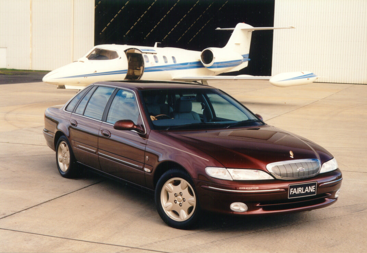 This archival image documents the 1998 Ford NL Fairlane Ghia Concorde at hangar with plane and is preserved in the Ford Heritage Vault as part of Ford Motor Company's historic photographic archive. Free for personal, non-commercial use. Ford Herit...