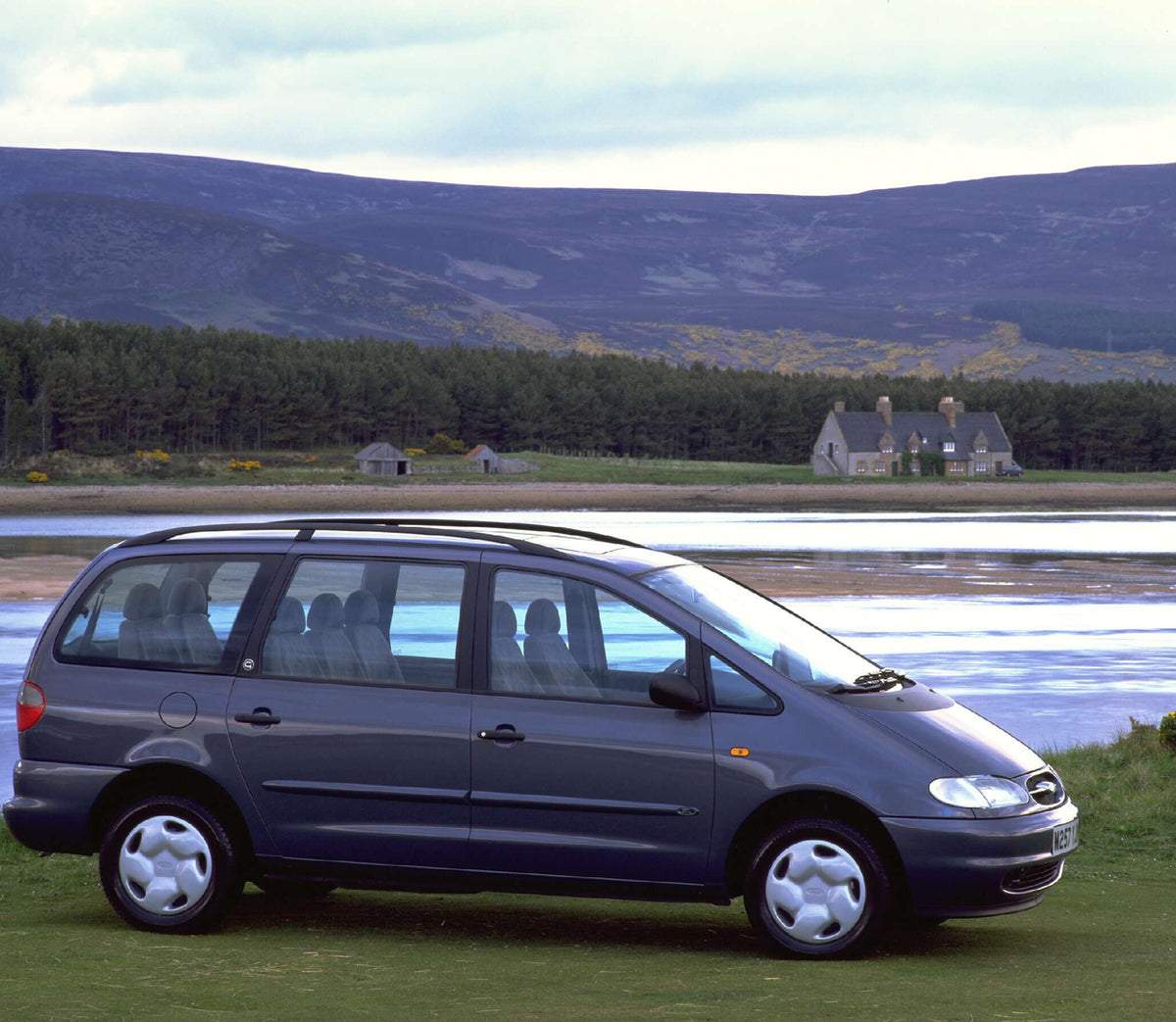 This archival image documents the 1995 Ford Galaxy Mark I GLX side view near scenic body of water AR-2002-213709 and is preserved in the Ford Heritage Vault as part of Ford Motor Company's historic photographic archive. Free for personal, non-comm...