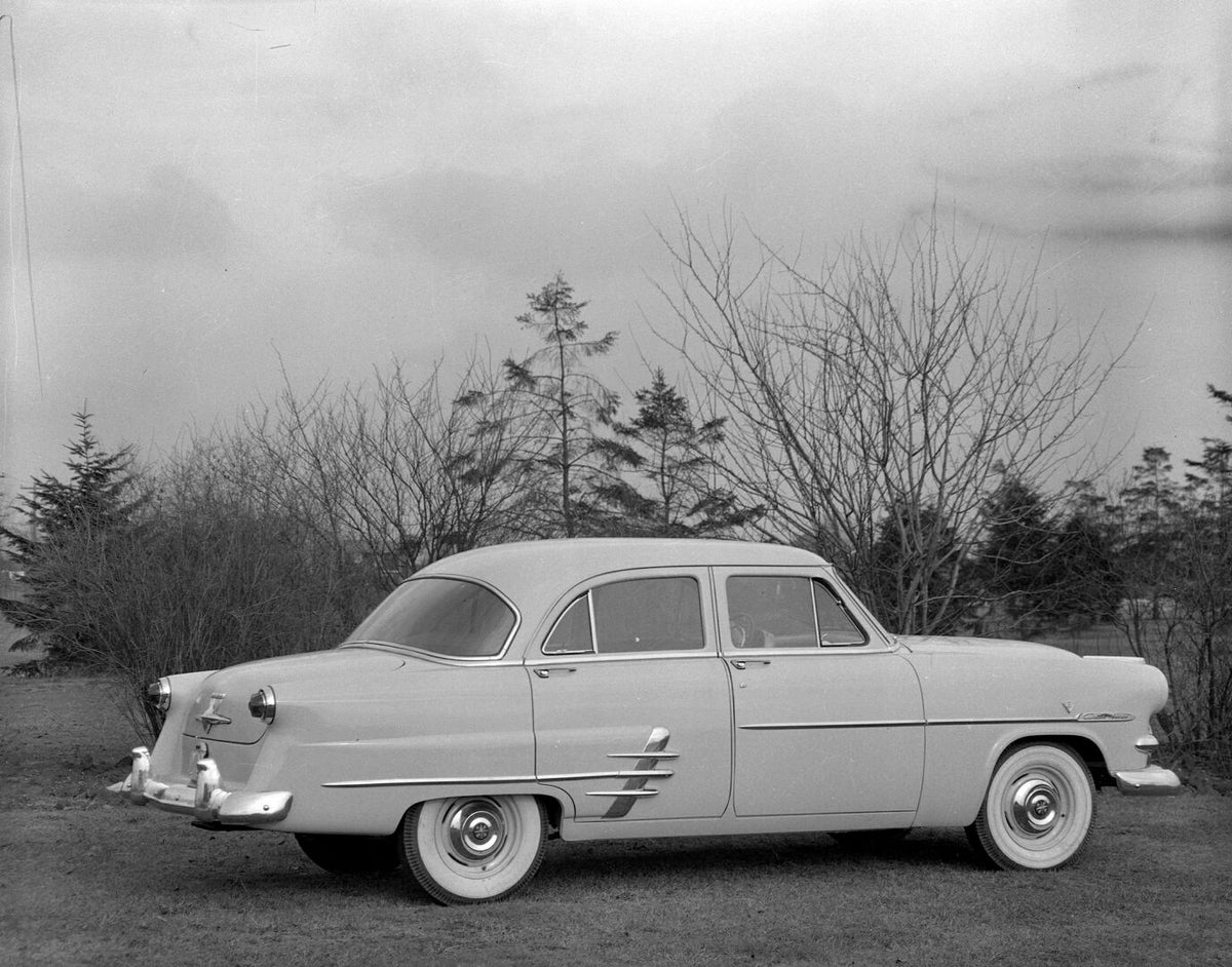 This archival image documents the 1953 Meteor Customline Sedan rear view with scenic trees AR-2007-5 and is preserved in the Ford Heritage Vault as part of Ford Motor Company's historic photographic archive. Free for personal, non-commercial use. ...