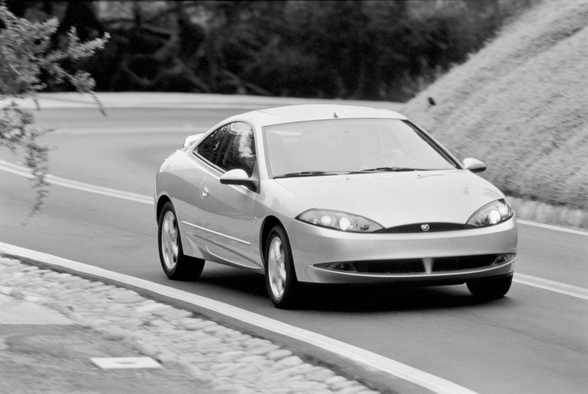 This archival image documents the 2000 Mercury Cougar on Road and is preserved in the Ford Heritage Vault as part of Ford Motor Company's historic photographic archive. Free for personal, non-commercial use. Ford Heritage Vault reference AR-2008-8...