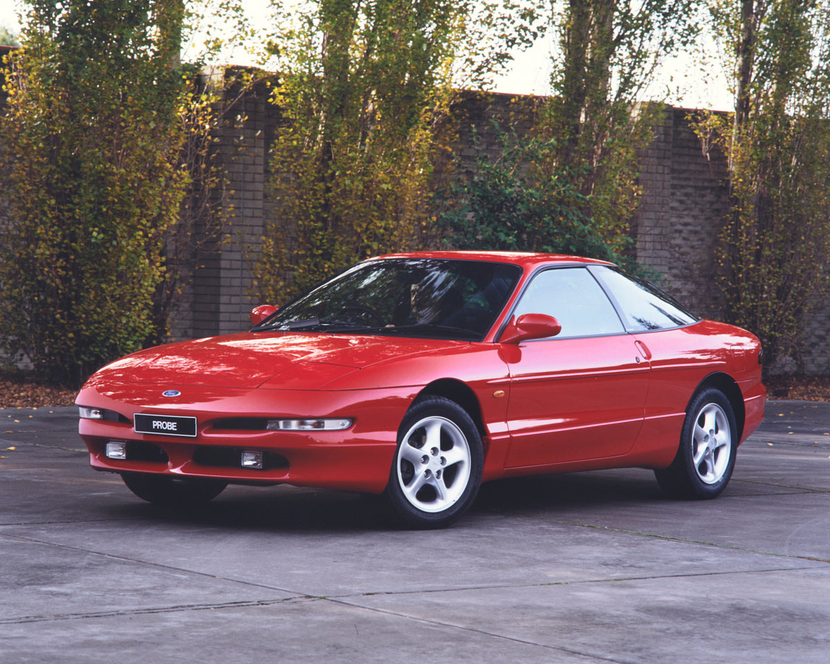 This archival image documents the 1994 Ford Probe Passenger Side Front End View in Driveway FAP-2011-3 and is preserved in the Ford Heritage Vault as part of Ford Motor Company's historic photographic archive. Free for personal, non-commercial use...