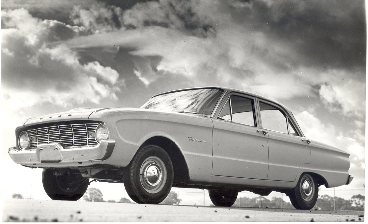 This archival image documents the 1960 Ford XK Falcon with scenic cloudy sky and is preserved in the Ford Heritage Vault as part of Ford Motor Company's historic photographic archive. Free for personal, non-commercial use. Ford Heritage Vault refe...