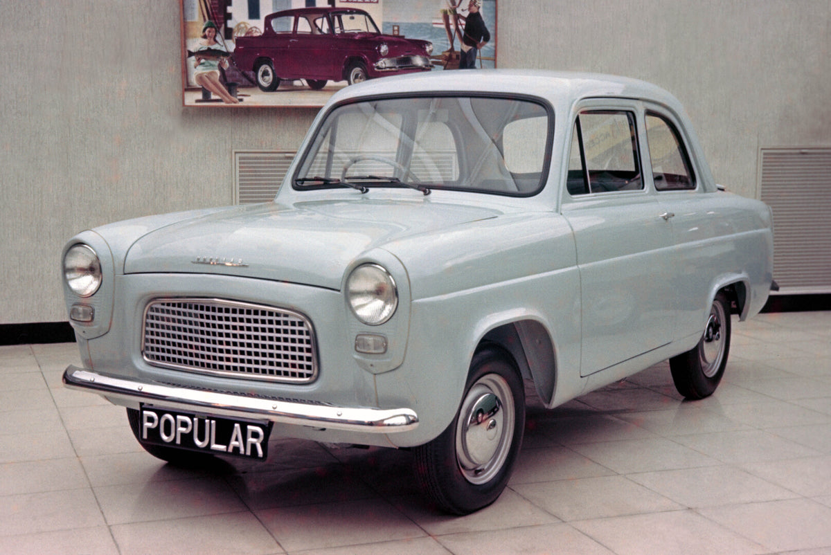 This archival image documents the 1959 Ford Popular 100E front 3/4 view in showroom and is preserved in the Ford Heritage Vault as part of Ford Motor Company's historic photographic archive. Free for personal, non-commercial use. Ford Heritage Vau...