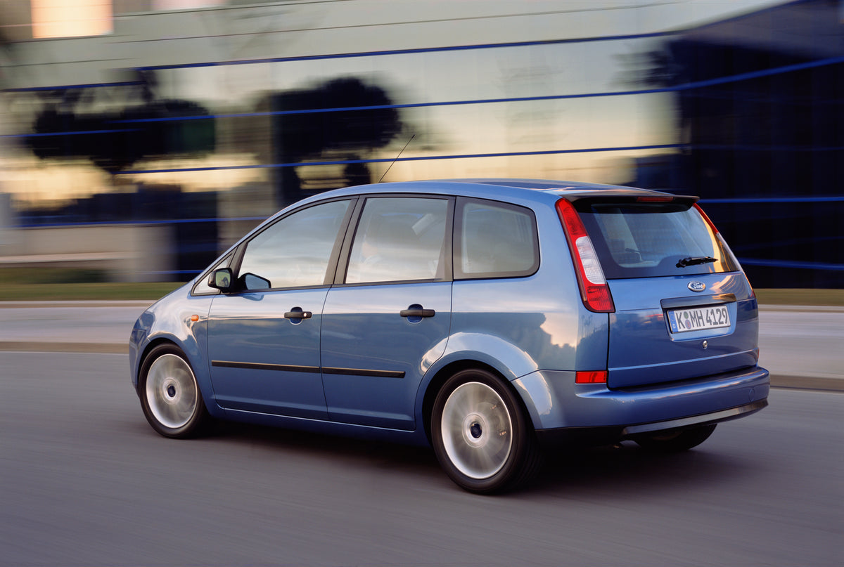 This archival image documents the 2003 Ford C-Max Mark I rear view action shot and is preserved in the Ford Heritage Vault as part of Ford Motor Company's historic photographic archive. Free for personal, non-commercial use. Ford Heritage Vault re...