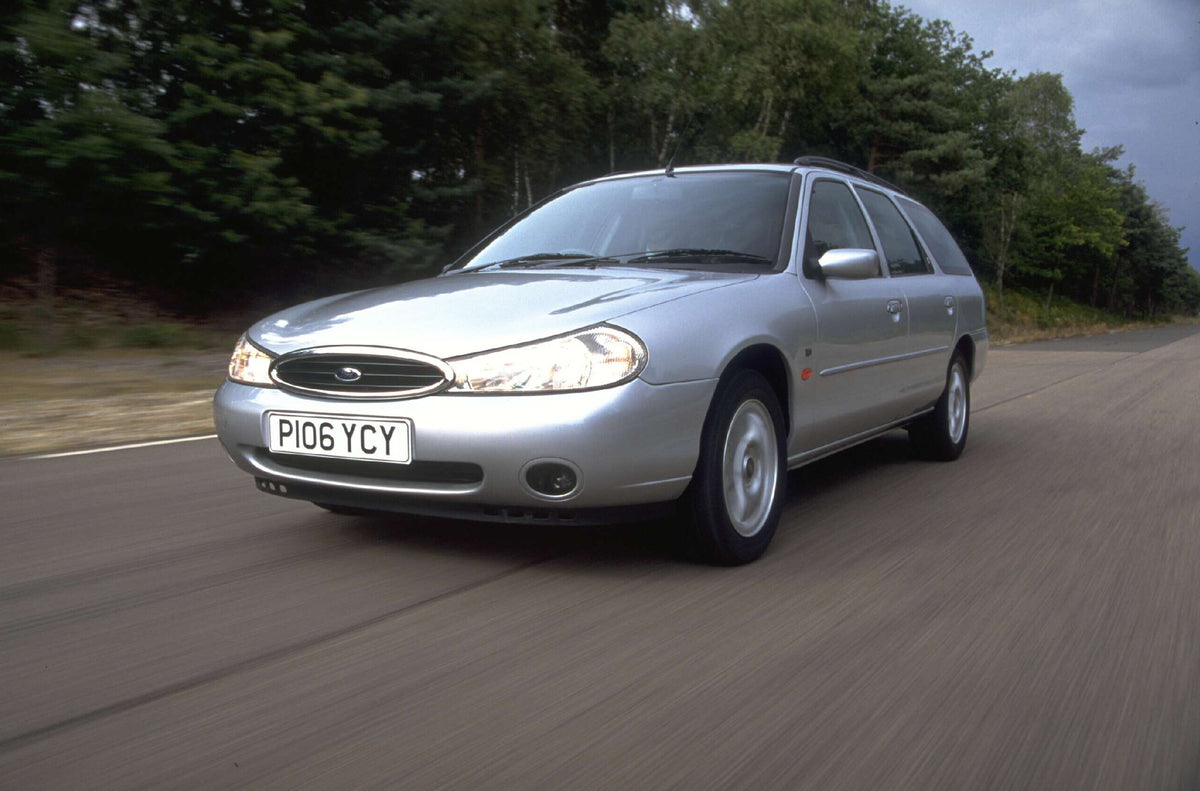 This archival image documents the 1996 Ford Mondeo Mark I Ghia TD action shot on scenic road AR-2002-213709 and is preserved in the Ford Heritage Vault as part of Ford Motor Company's historic photographic archive. Free for personal, non-commercia...