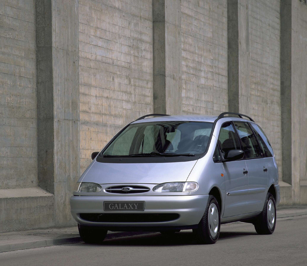 This archival image documents the 1995 Ford Galaxy Mark I Ghia on road with cement wall AR-2002-213709 and is preserved in the Ford Heritage Vault as part of Ford Motor Company's historic photographic archive. Free for personal, non-commercial use...