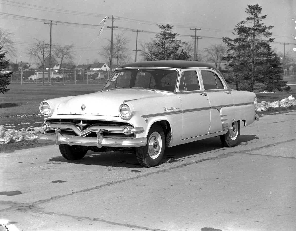 This archival image documents the 1954 Meteor Niagara Sedan on scenic road with trees AR-2007-5 and is preserved in the Ford Heritage Vault as part of Ford Motor Company's historic photographic archive. Free for personal, non-commercial use. Ford ...