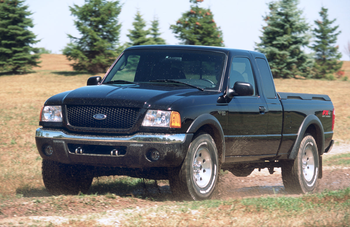 This archival image documents the 2002 Ford Ranger XLT pickup truck scenic and is preserved in the Ford Heritage Vault as part of Ford Motor Company's historic photographic archive. Free for personal, non-commercial use. Ford Heritage Vault refere...