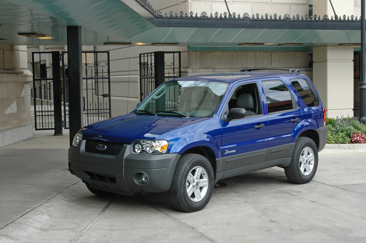 This archival image documents the 2004 Ford Escape hybrid vehicle outside Detroit Athletic Club parking garage and is preserved in the Ford Heritage Vault as part of Ford Motor Company's historic photographic archive. Free for personal, non-commer...