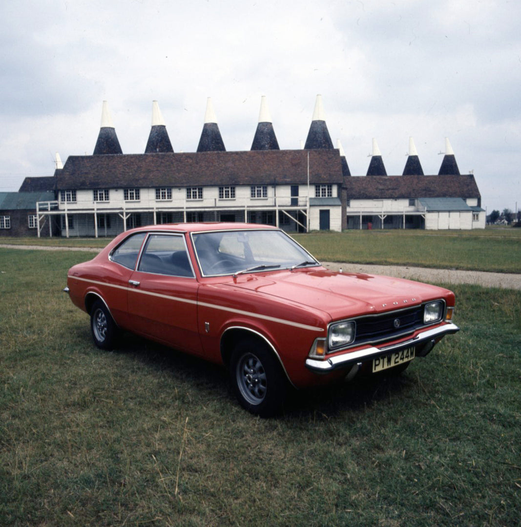 This archival image documents the 1974 Ford Cortina GT 2000 in front of scenic building and is preserved in the Ford Heritage Vault as part of Ford Motor Company's historic photographic archive. Free for personal, non-commercial use. Ford Heritage...