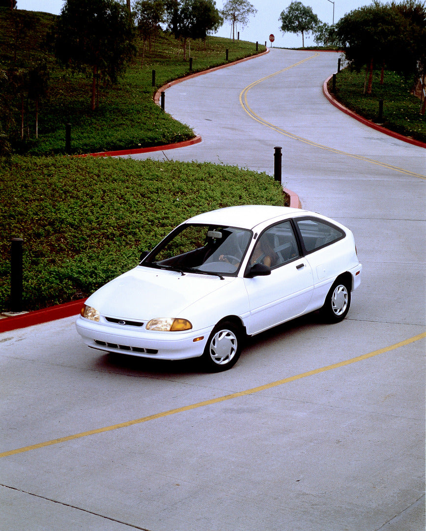 This archival image documents the 1994 Ford Aspire two-door and is preserved in the Ford Heritage Vault as part of Ford Motor Company's historic photographic archive. Free for personal, non-commercial use. Ford Heritage Vault reference AR-2001-94-...