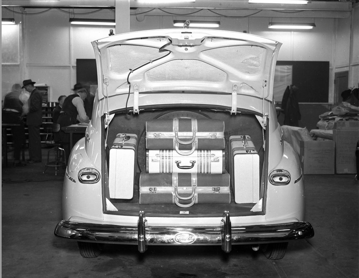 This archival image documents the 1942 Ford Deluxe luggage compartment, May 1945 first postwar civilian vehicle and is preserved in the Ford Heritage Vault as part of Ford Motor Company's historic photographic archive. Free for personal, non-comme...
