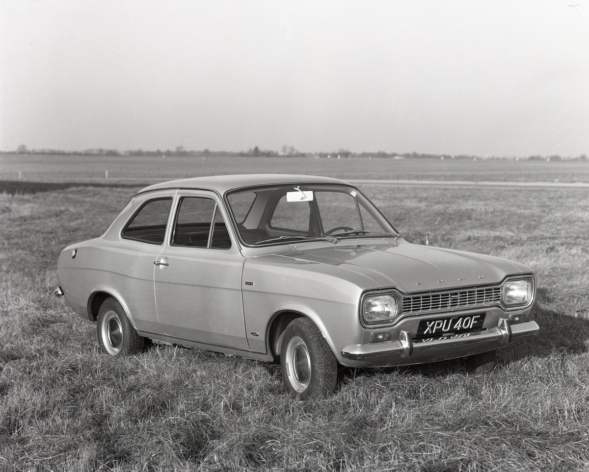 This archival image documents the 1967 Ford Escort Mark I LHD Super in scenic field and is preserved in the Ford Heritage Vault as part of Ford Motor Company's historic photographic archive. Free for personal, non-commercial use. Ford Heritage Vau...