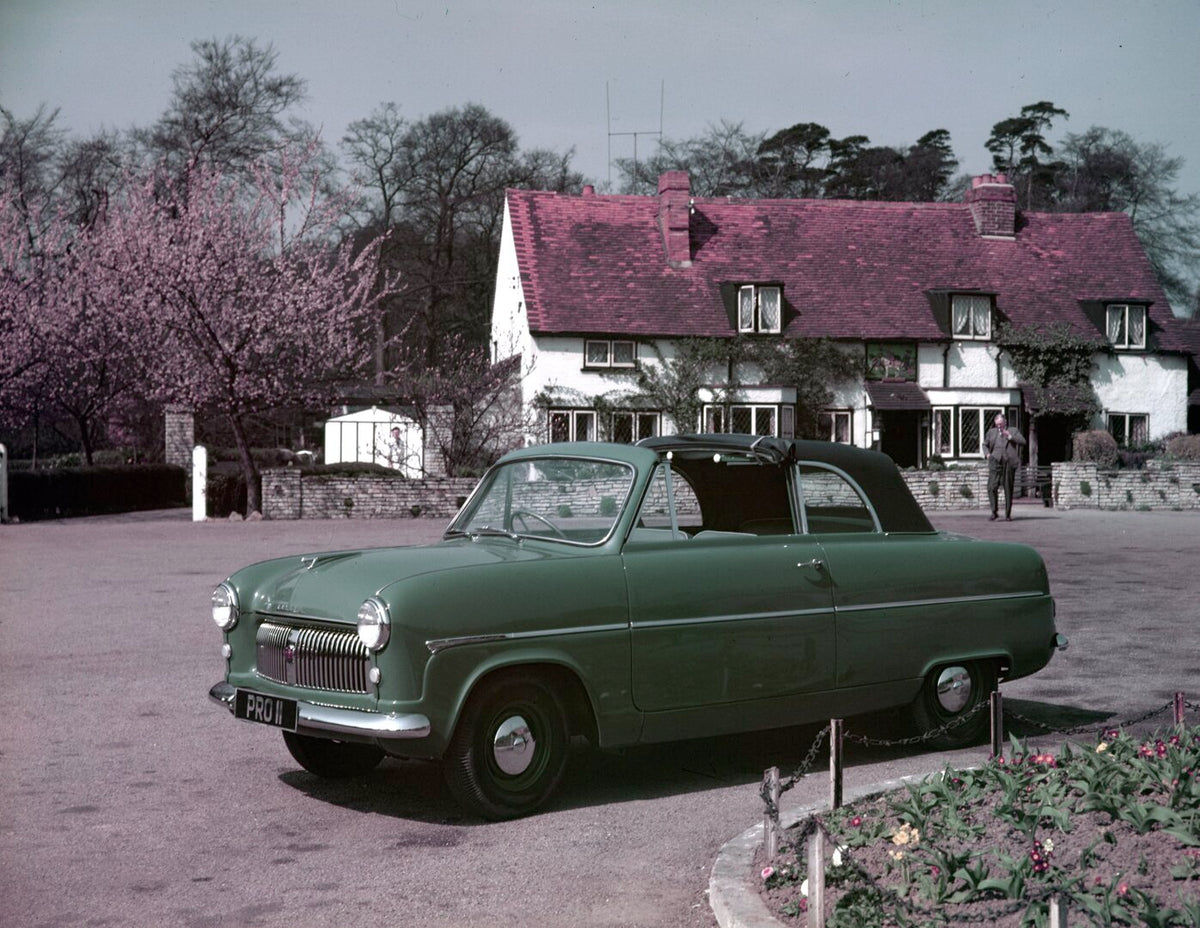 This archival image documents the 1954 Ford Consul Mark I convertible in front of scenic house with trees and is preserved in the Ford Heritage Vault as part of Ford Motor Company's historic photographic archive. Free for personal, non-commercial ...