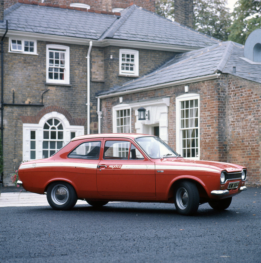 This archival image documents the 1971 Escort Mexico Mark I 1600 GT in front of brick house and is preserved in the Ford Heritage Vault as part of Ford Motor Company's historic photographic archive. Free for personal, non-commercial use. Ford Heri...