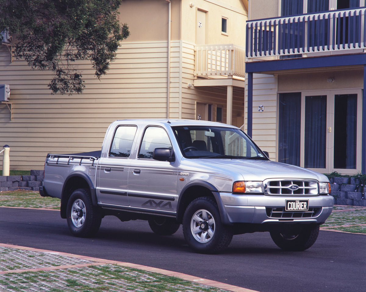 This archival image documents the 2001 Ford Courier XLT Turbo Diesel Pickup Truck Driver Side Front End View on Neighborhood Street FAP-2011-3 and is preserved in the Ford Heritage Vault as part of Ford Motor Company's historic photographic archiv...