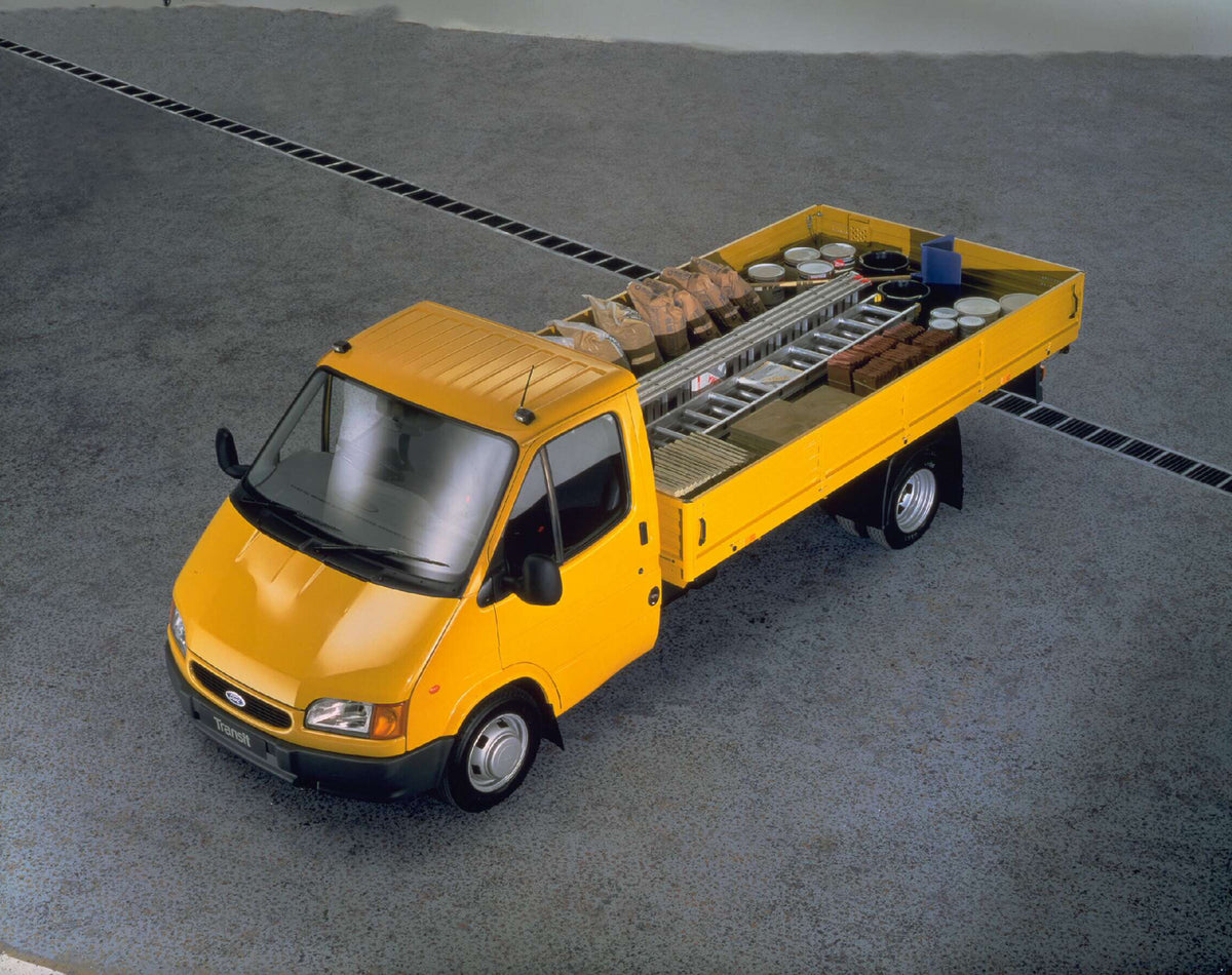 This archival image documents the 1996 Ford Transit Mark III Long Wheelbase Dropside aerial view AR-2002-213709 and is preserved in the Ford Heritage Vault as part of Ford Motor Company's historic photographic archive. Free for personal, non-comme...