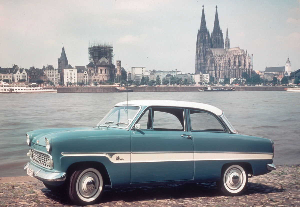 This archival image documents the 1959 Ford Taunus 12M P1 with Cologne Cathedral in distance and is preserved in the Ford Heritage Vault as part of Ford Motor Company's historic photographic archive. Free for personal, non-commercial use. Ford Her...