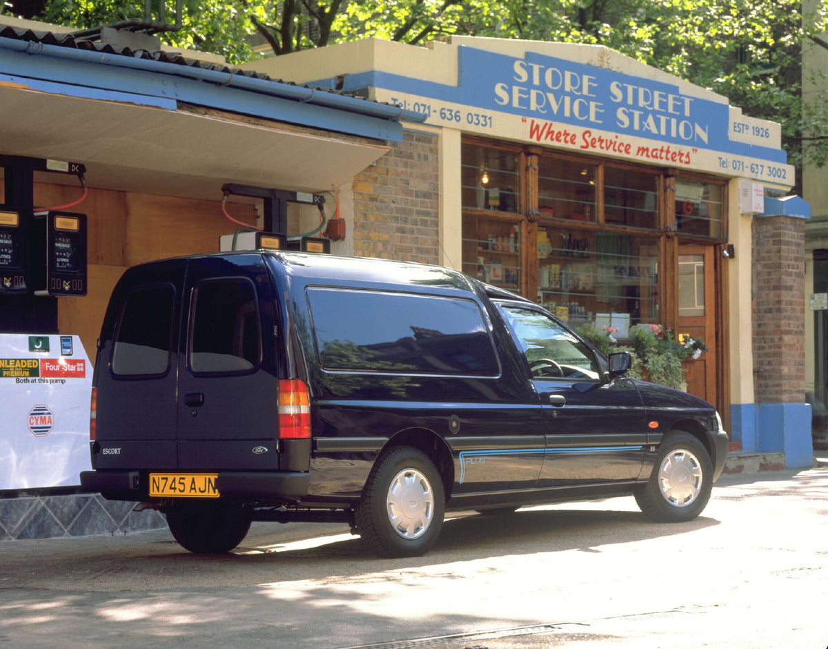 This archival image documents the 1995 Ford Escort Mark VI Van rear view at gas station AR-2002-213709 and is preserved in the Ford Heritage Vault as part of Ford Motor Company's historic photographic archive. Free for personal, non-commercial use...