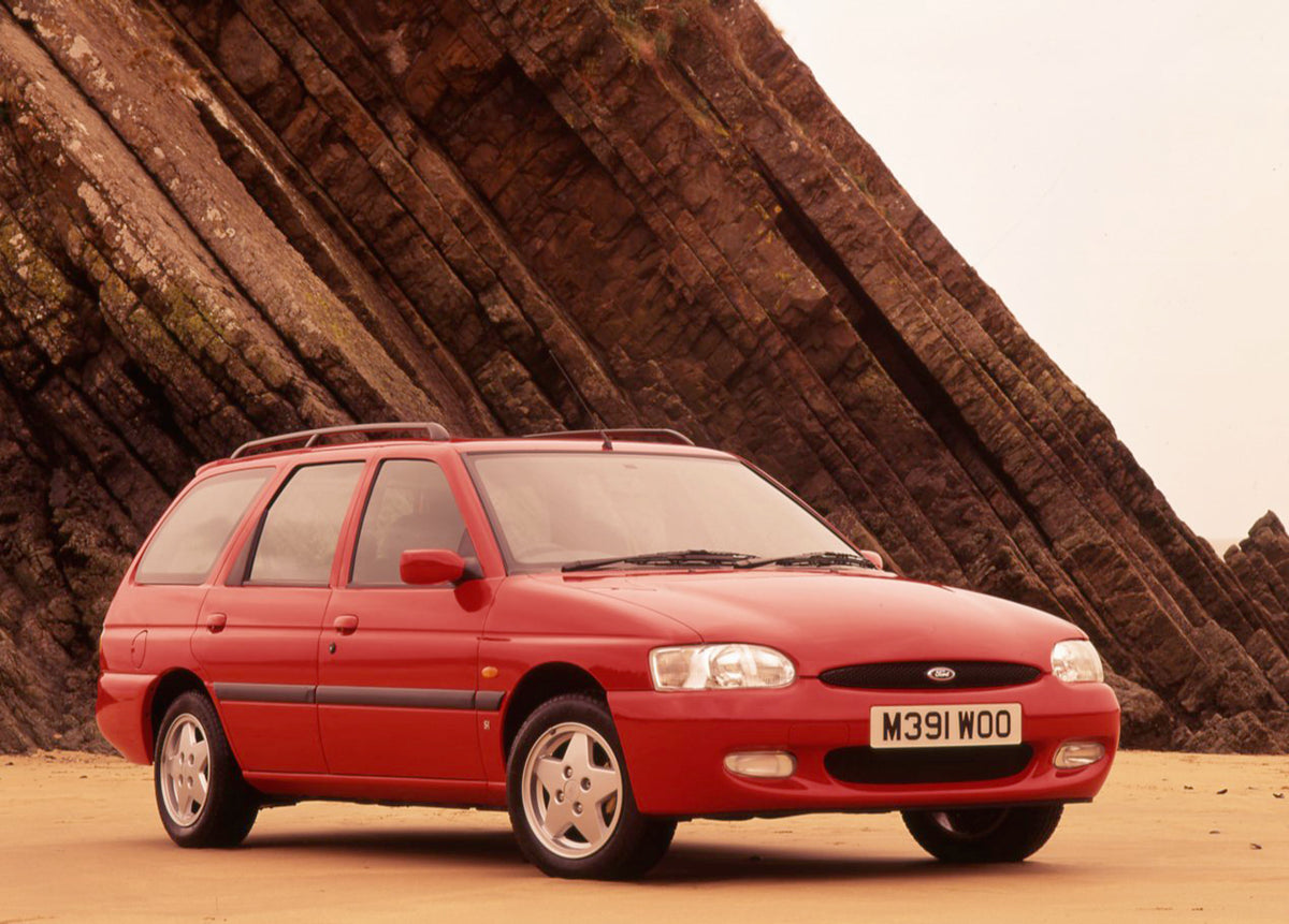 This archival image documents the 1995 Ford Escort Mark VI Si Estate with scenic rock formation and is preserved in the Ford Heritage Vault as part of Ford Motor Company's historic photographic archive. Free for personal, non-commercial use. Ford ...
