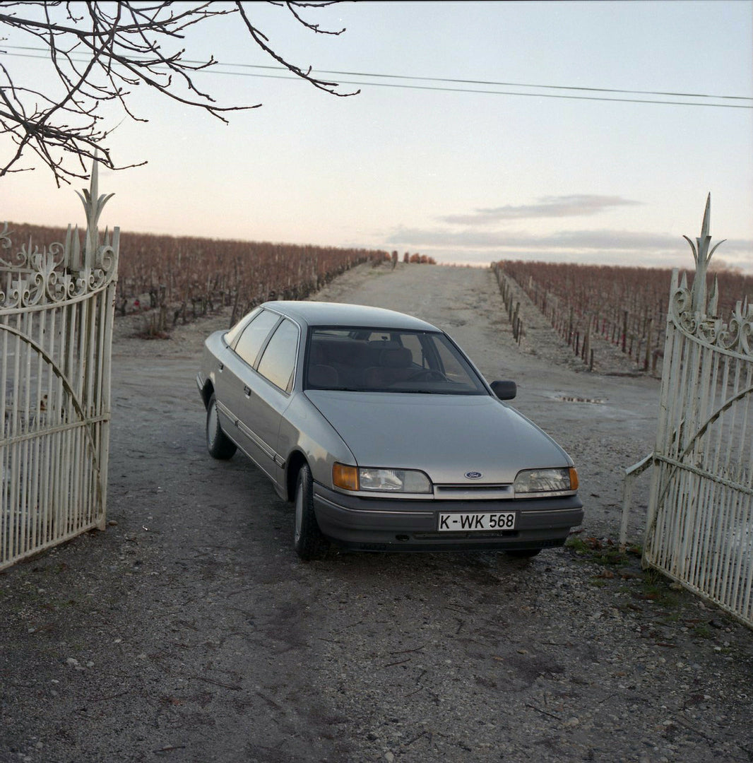 This archival image documents the 1984 Ford Scorpio Mark I LHD on scenic dirt road with gate in Bordeaux and is preserved in the Ford Heritage Vault as part of Ford Motor Company's historic photographic archive. Free for personal, non-commercial u...