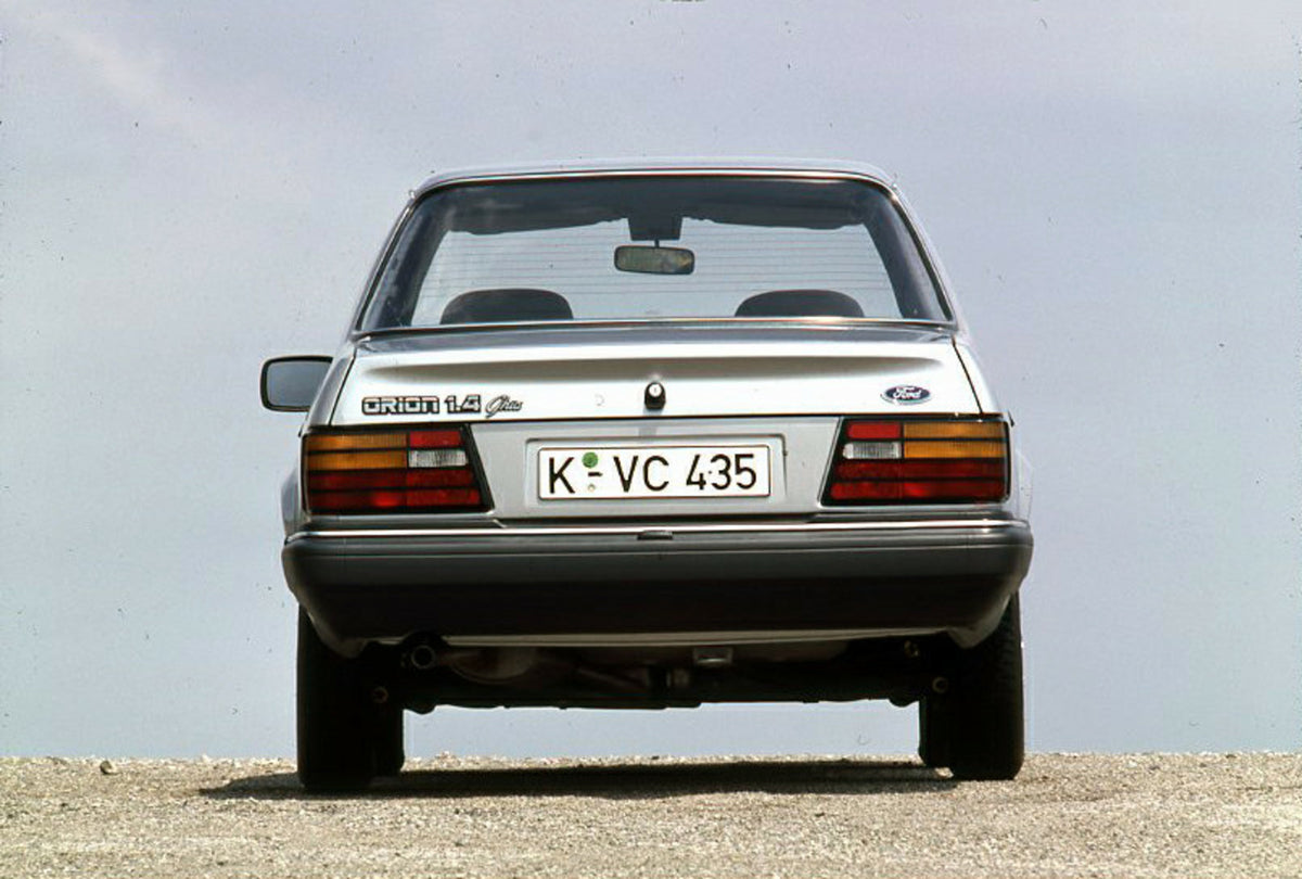 This archival image documents the 1986 Ford Orion Mark II 1.4 Ghia rear view with scenic blue sky and is preserved in the Ford Heritage Vault as part of Ford Motor Company's historic photographic archive. Free for personal, non-commercial use. For...
