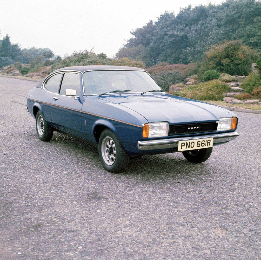 This archival image documents the 1976 Ford Capri Mark II on scenic road with trees 1976--Capri 839--L 1.6mk2 and is preserved in the Ford Heritage Vault as part of Ford Motor Company's historic photographic archive. Free for personal, non-commerc...