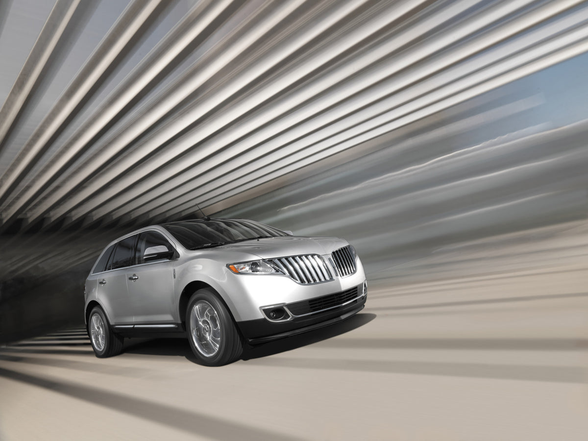 This archival image documents the 2014 Lincoln MKX action shot and is preserved in the Ford Heritage Vault as part of Ford Motor Company's historic photographic archive. Free for personal, non-commercial use. Ford Heritage Vault reference AR-2008-...