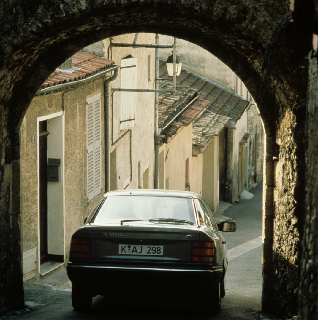 This archival image documents the 1985 Ford Scorpio Mark I rear view in scenic alley and is preserved in the Ford Heritage Vault as part of Ford Motor Company's historic photographic archive. Free for personal, non-commercial use. Ford Heritage Va...