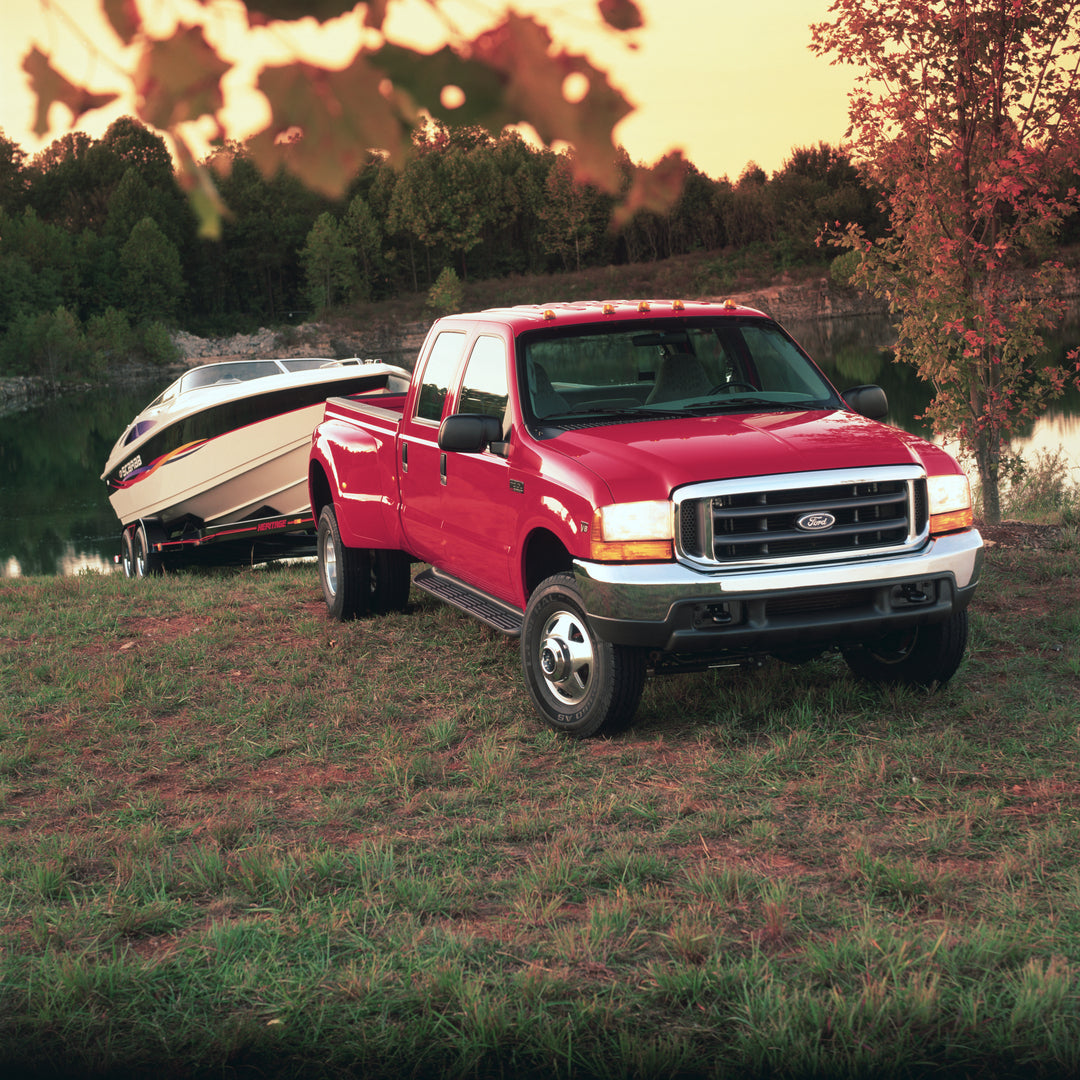 This archival image documents the 1999 Ford F-350 Super Duty truck towing boat and is preserved in the Ford Heritage Vault as part of Ford Motor Company's historic photographic archive. Free for personal, non-commercial use. Ford Heritage Vault re...