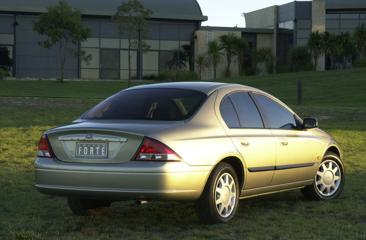 This archival image documents the 1998 Ford Falcon Forte rear view on grass in front of building DSC_0025 and is preserved in the Ford Heritage Vault as part of Ford Motor Company's historic photographic archive. Free for personal, non-commercial ...