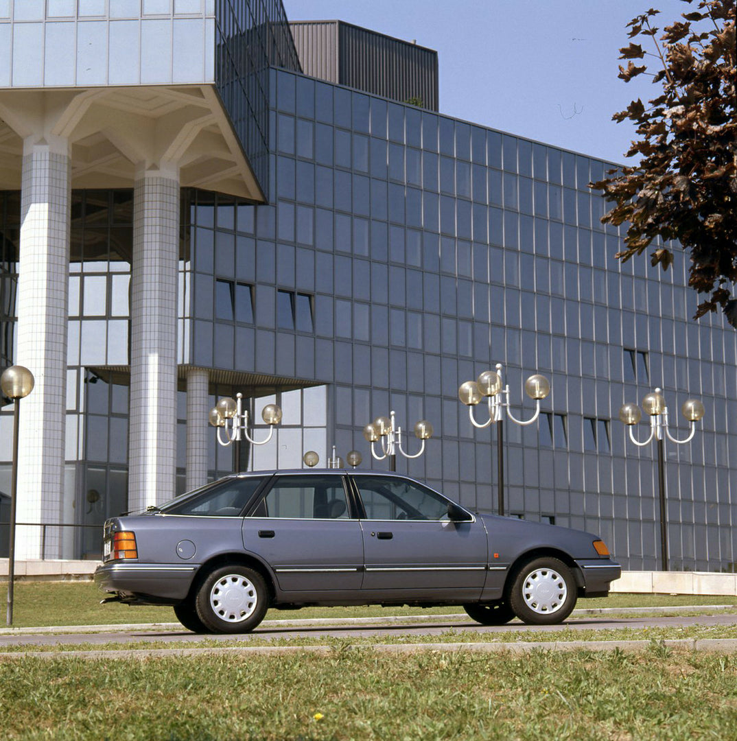 This archival image documents the 1989 Ford Scorpio Mark I rear view near scenic glass building and is preserved in the Ford Heritage Vault as part of Ford Motor Company's historic photographic archive. Free for personal, non-commercial use. Ford ...