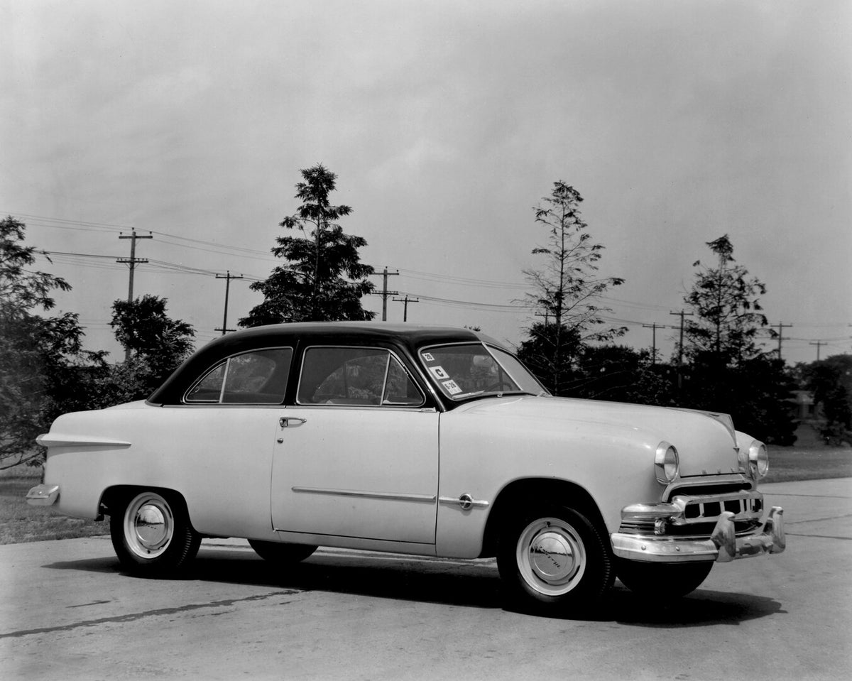 This archival image documents the 1951 Meteor Coupe on scenic road with trees AR-2007-5 and is preserved in the Ford Heritage Vault as part of Ford Motor Company's historic photographic archive. Free for personal, non-commercial use. Ford Heritage...