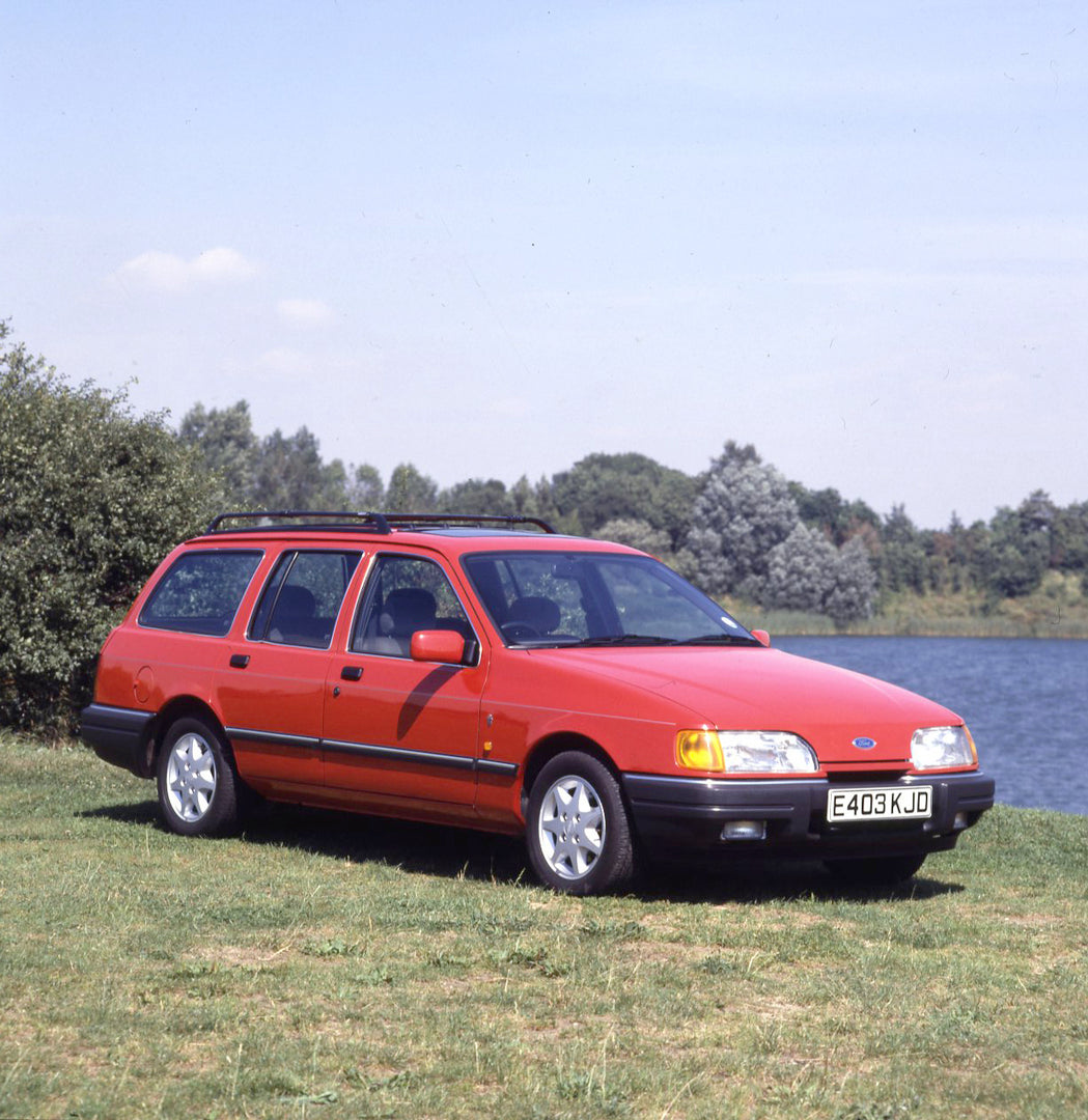 This archival image documents the 1987 Ford Sierra Mark II Ghia 4x4 Estate near scenic lake with trees and is preserved in the Ford Heritage Vault as part of Ford Motor Company's historic photographic archive. Free for personal, non-commercial use...