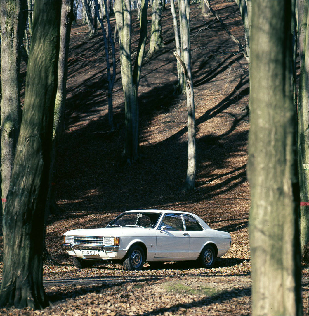 This archival image documents the 1973 Ford Consul in scenic forest and is preserved in the Ford Heritage Vault as part of Ford Motor Company's historic photographic archive. Free for personal, non-commercial use. Ford Heritage Vault reference AR-...