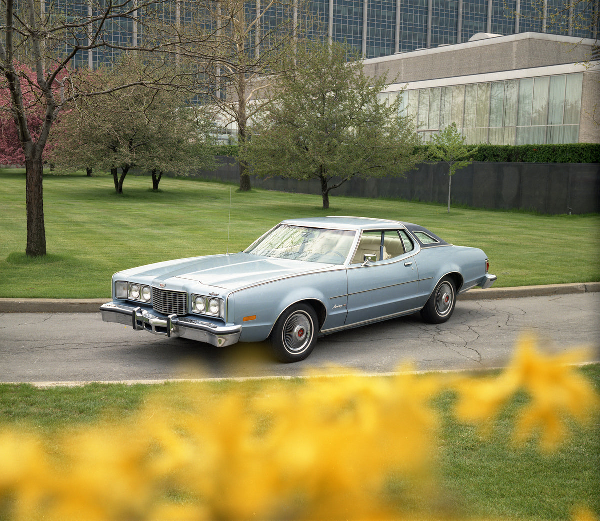 This archival image documents the 1976 Mercury Montego MX two-door with Building in Background and Flowers in Foreground and is preserved in the Ford Heritage Vault as part of Ford Motor Company's historic photographic archive. Free for personal, ...