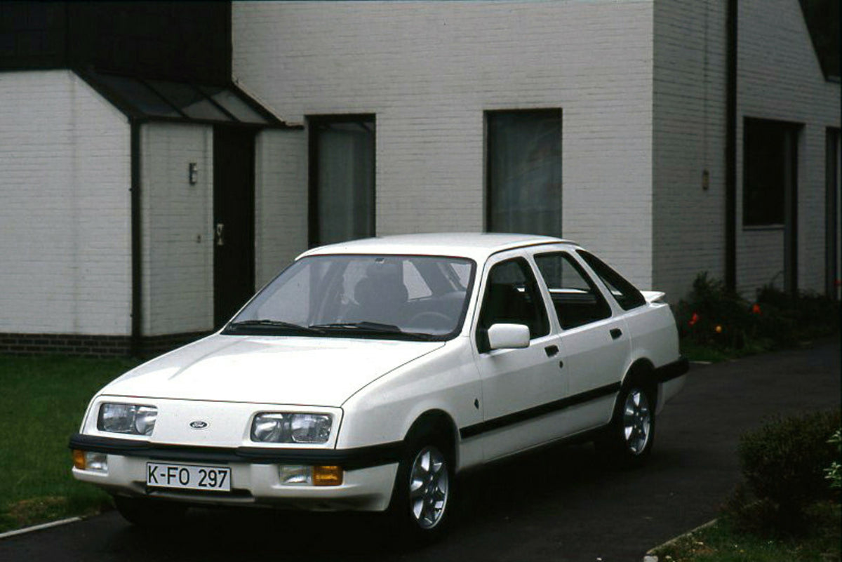 This archival image documents the 1985 Ford Sierra XR 4x4 LHD closeup in driveway and is preserved in the Ford Heritage Vault as part of Ford Motor Company's historic photographic archive. Free for personal, non-commercial use. Ford Heritage Vault...