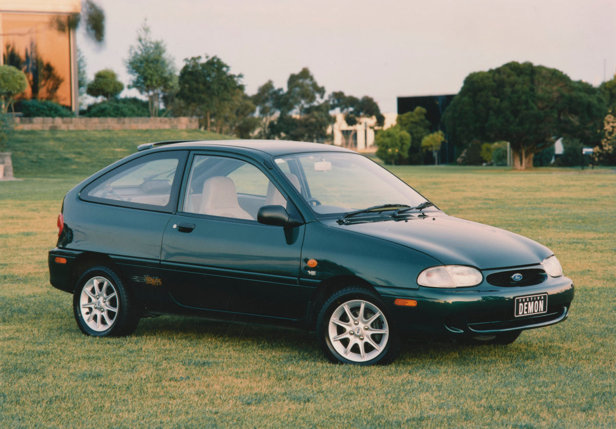 This archival image documents the 1998 Ford WD Festiva Demon Driver Side Front End View on Grass Lawn FAP-2011-3 and is preserved in the Ford Heritage Vault as part of Ford Motor Company's historic photographic archive. Free for personal, non-comm...