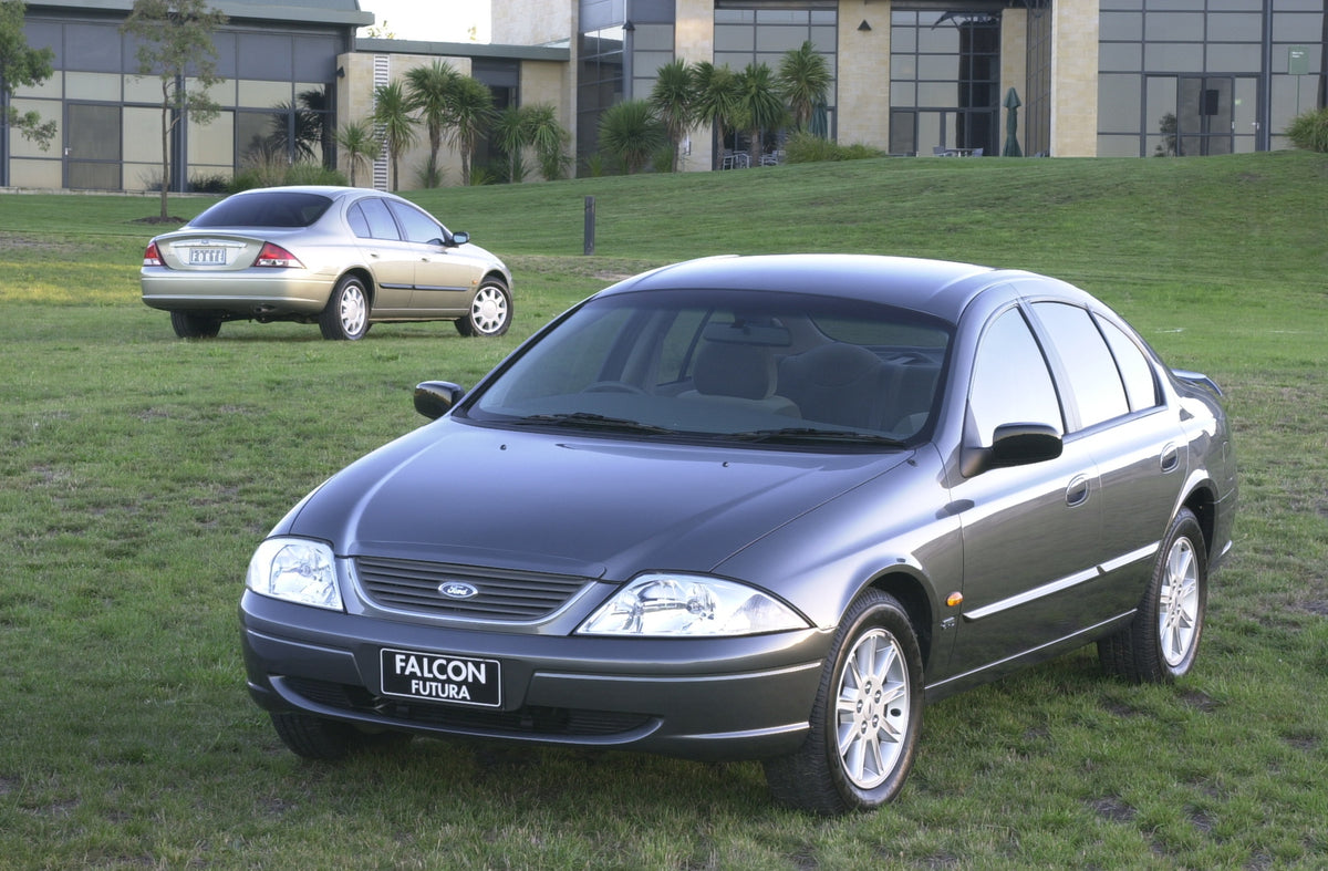This archival image documents the 1998 Ford Falcons front and rear view on grass in front of building DSC_0021 and is preserved in the Ford Heritage Vault as part of Ford Motor Company's historic photographic archive. Free for personal, non-commer...