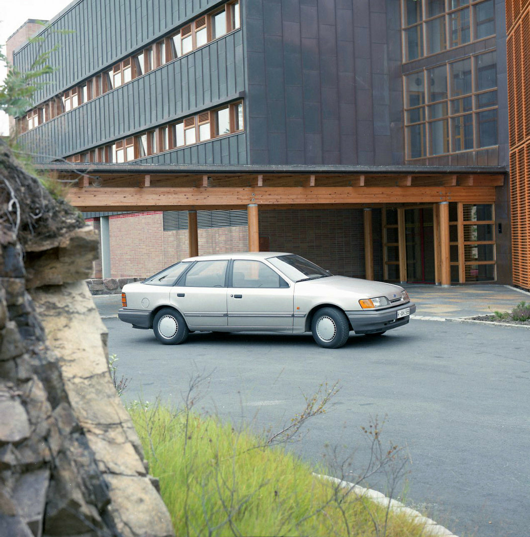 This archival image documents the 1984 Ford Scorpio Mark I CL in front of scenic building in Norway and is preserved in the Ford Heritage Vault as part of Ford Motor Company's historic photographic archive. Free for personal, non-commercial use. F...