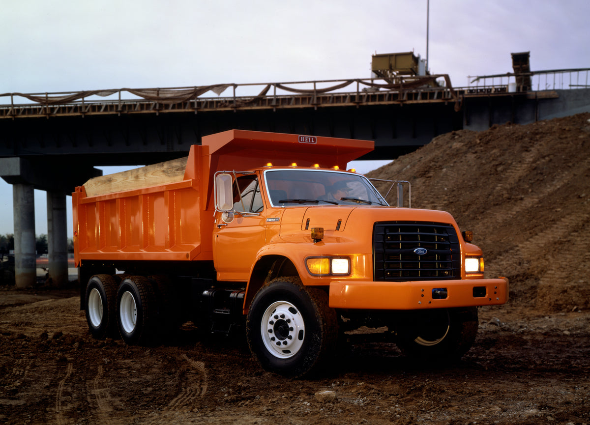 This archival image documents the 1995 Ford F-Series heavy duty dump truck and is preserved in the Ford Heritage Vault as part of Ford Motor Company's historic photographic archive. Free for personal, non-commercial use. Ford Heritage Vault refere...