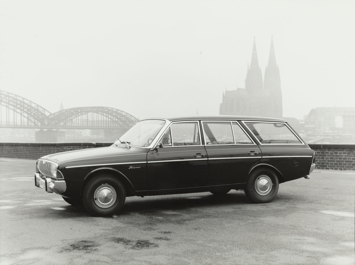 This archival image documents the 1964 Ford Taunus 20M P5 with Cologne Cathedral in distance and is preserved in the Ford Heritage Vault as part of Ford Motor Company's historic photographic archive. Free for personal, non-commercial use. Ford Her...