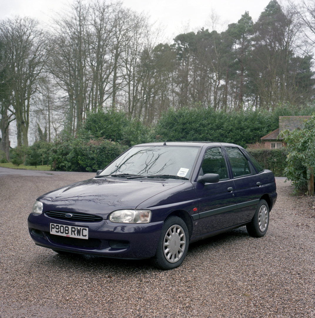 This archival image documents the 1997 Ford Escort Mark VI in scenic parking lot at Hollington Country House and is preserved in the Ford Heritage Vault as part of Ford Motor Company's historic photographic archive. Free for personal, non-commerci...