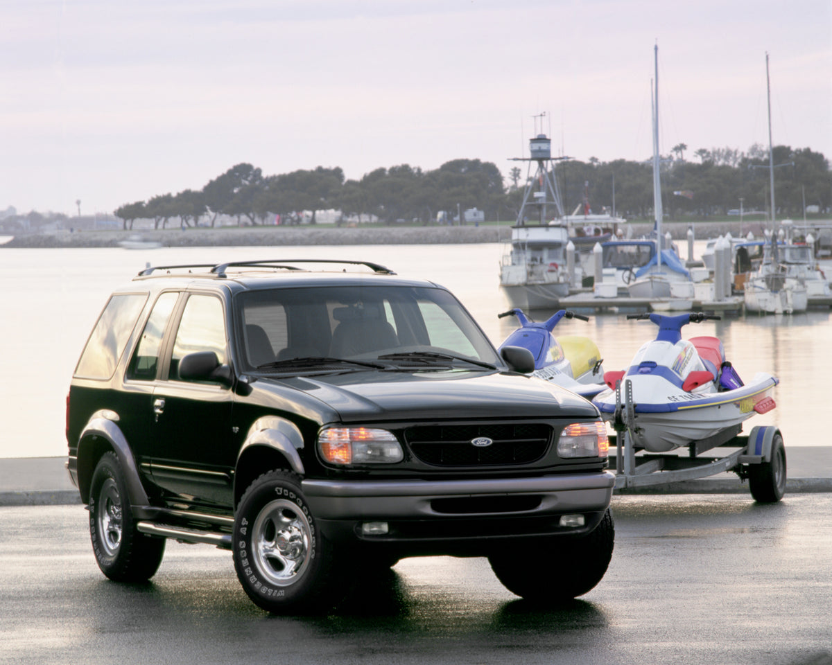 This archival image documents the 1998 Ford Explorer Sport at marina and is preserved in the Ford Heritage Vault as part of Ford Motor Company's historic photographic archive. Free for personal, non-commercial use. Ford Heritage Vault reference AR...
