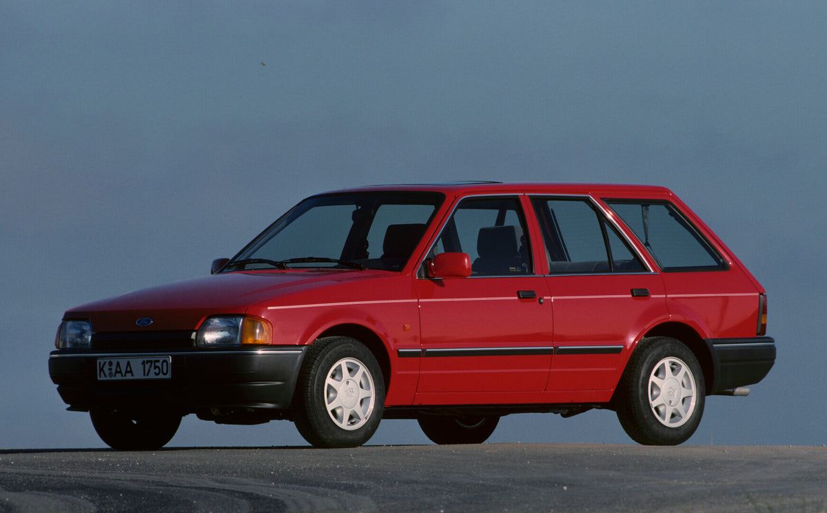 This archival image documents the 1990 Ford Escort Mark IV Turnier with scenic blue sky and is preserved in the Ford Heritage Vault as part of Ford Motor Company's historic photographic archive. Free for personal, non-commercial use. Ford Heritage...