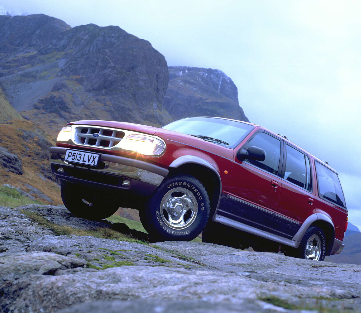 This archival image documents the 1996 Ford Explorer RHD in scenic mountains AR-2002-213709 and is preserved in the Ford Heritage Vault as part of Ford Motor Company's historic photographic archive. Free for personal, non-commercial use. Ford Heri...