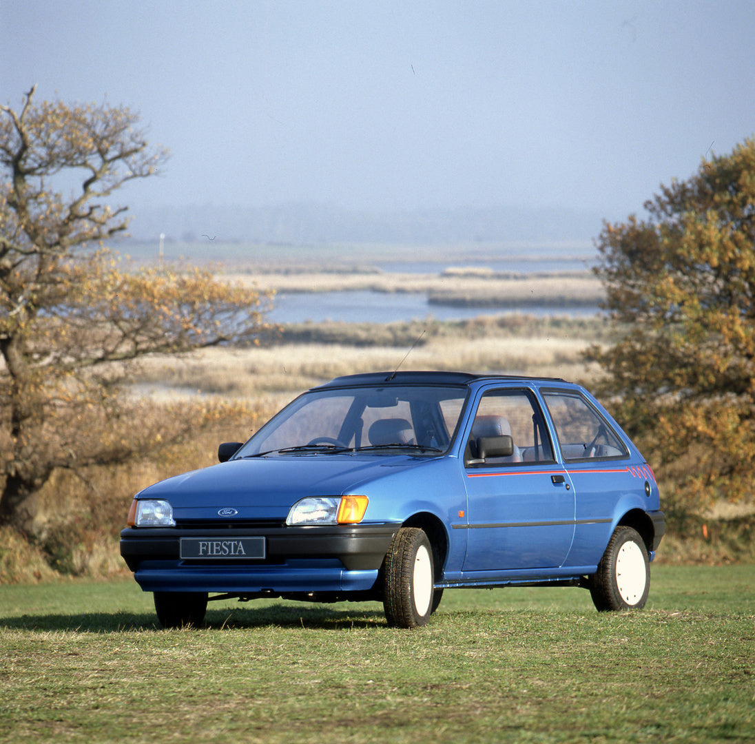 This archival image documents the 1990 Ford Fiesta Mark III Calypso with scenic waterway and is preserved in the Ford Heritage Vault as part of Ford Motor Company's historic photographic archive. Free for personal, non-commercial use. Ford Heritag...