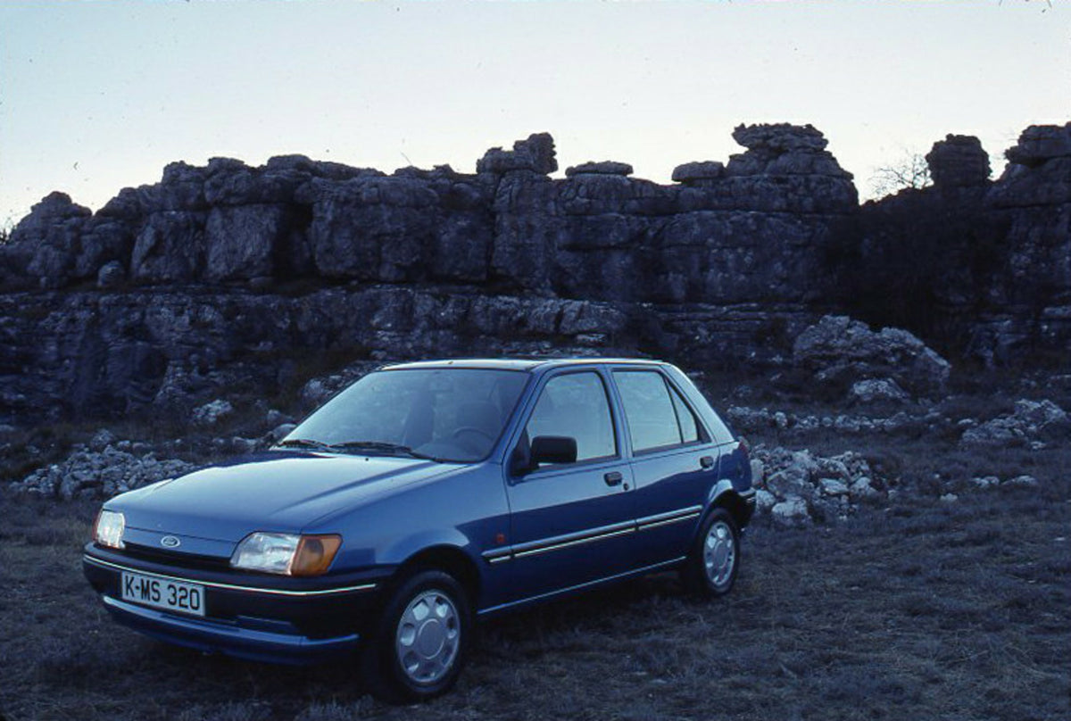 This archival image documents the 1989 Ford Fiesta Mark III LHD with scenic rock formation and is preserved in the Ford Heritage Vault as part of Ford Motor Company's historic photographic archive. Free for personal, non-commercial use. Ford Herit...