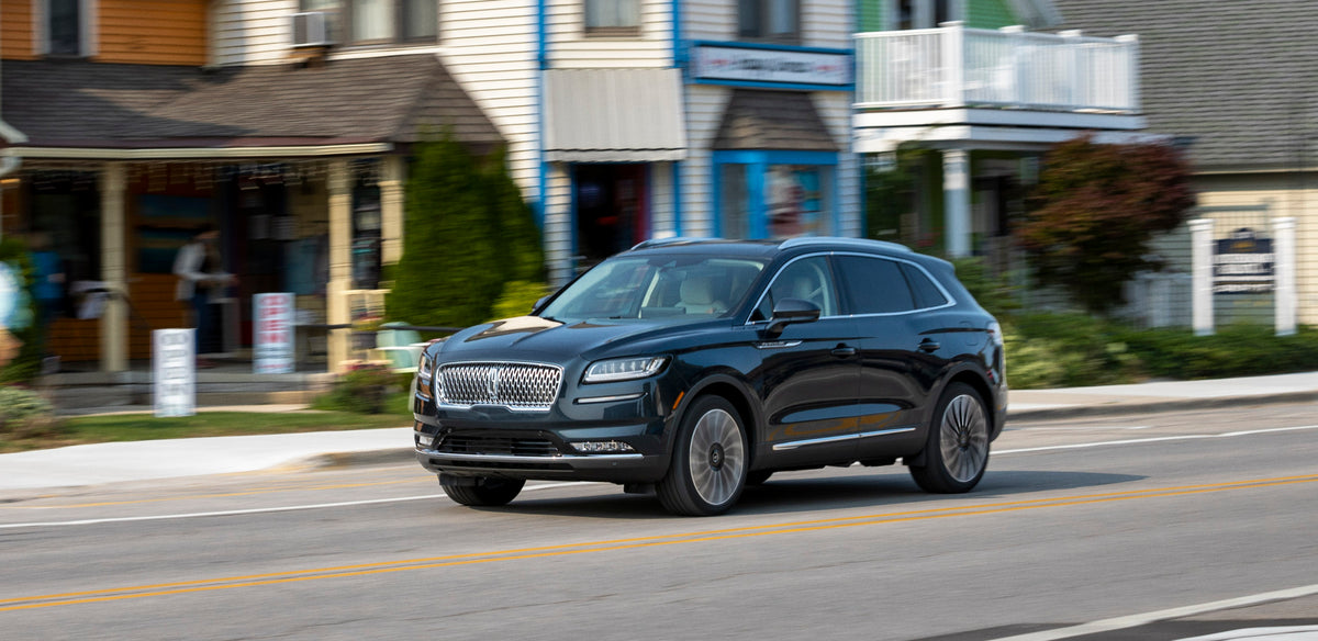 This archival image documents the 2021 Lincoln Nautilus action shot on scenic street and is preserved in the Ford Heritage Vault as part of Ford Motor Company's historic photographic archive. Free for personal, non-commercial use. Ford Heritage Va...
